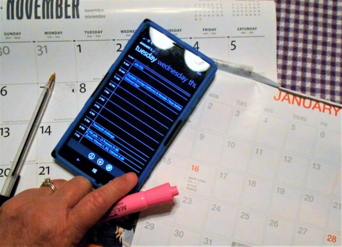 Calendar! Person Planning Events for the New Year! Using Electronics and Paper Calendar!